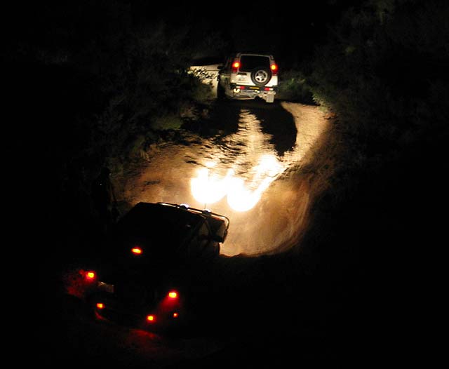 Todd Works his way up an obstacle.  Jess's truck is just ahead.
