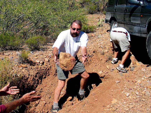 Rob gets a rock tossed to him while helping to get Mike unstuck.