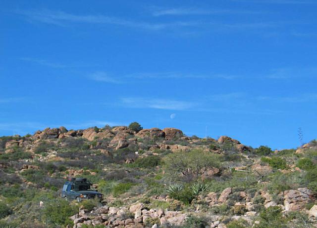 Mike drives the trail with the moon visible in the center of the picture.  Sorry it's blurry.