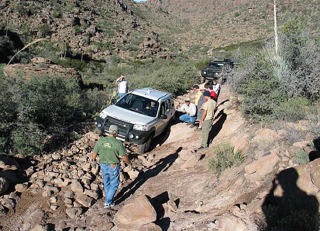 Everyone guides the Freelander over a tough section.