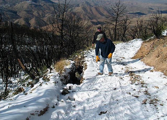 Mike tosses a rock hoping to help the erosion problem.