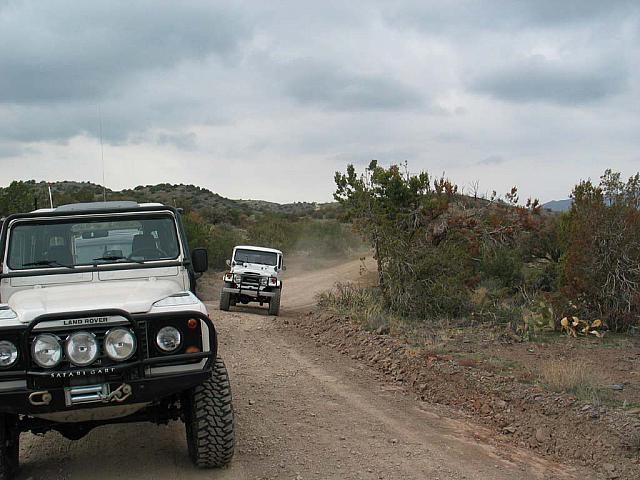 An old toyota passes us on the trail.