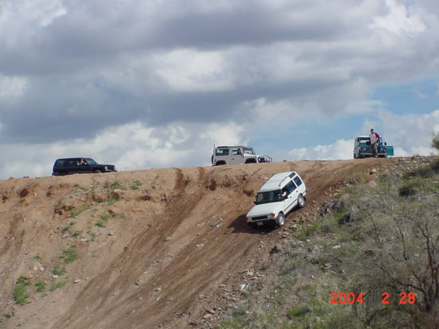 Everybody takes their turn going down the hill.