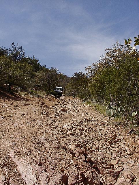 Robert making his way down the steep and off camber trail