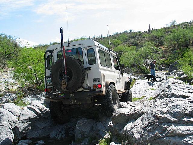 Leo drives over the rocks