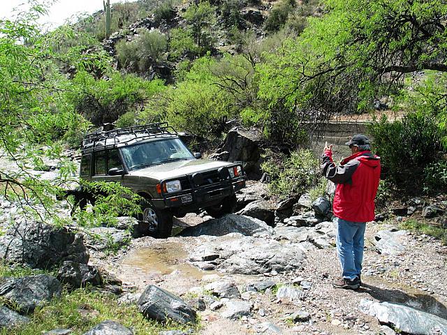 Leo spots mike over some wet rocks