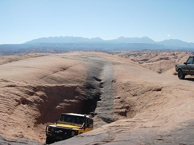 Moab - Poison Spider Mesa  -  Rob coming out of a pothole