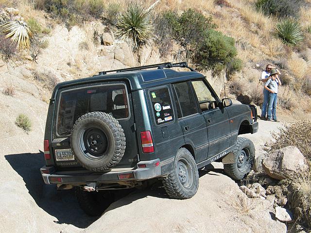 Jon Christensen gets twisted up as Rob and Jennie look on
