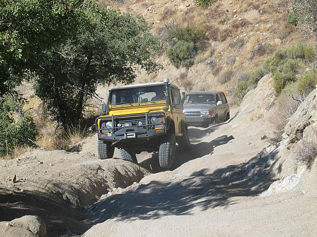 Rob lifts a tire as John Shotts waits his turn