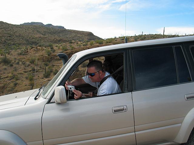 John Shotts takes a photograph..