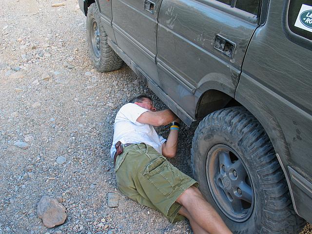Mike tightens a loose nut on his Disco's trailing arm.