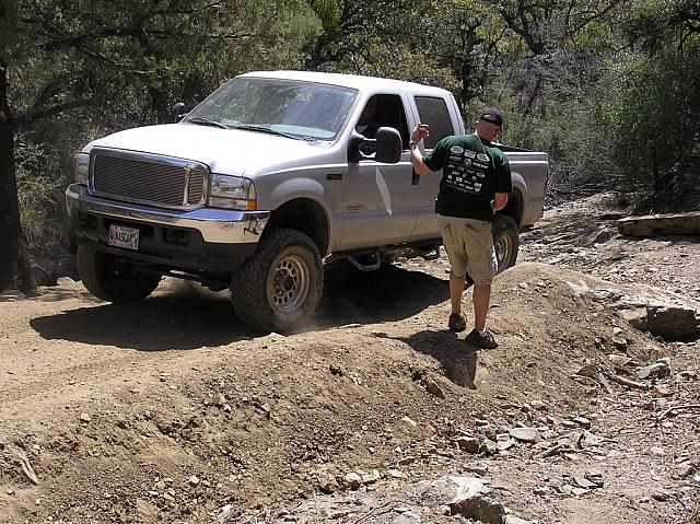 F250 rubbed his side steps a bit, but made it over.