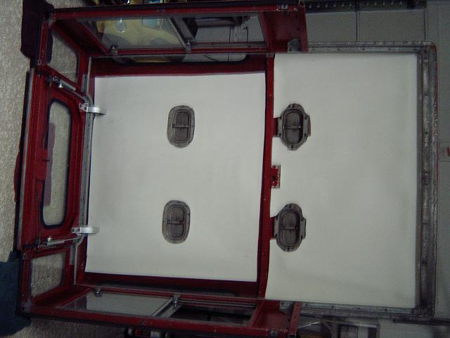 Installing the new insulation for under the headliner