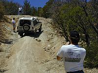 George climbs up the hill while David takes pictures