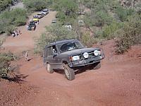 Todd stuffing his rear tire climing the hill
