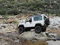 Leo having fun driving over a rock