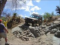 Rob raises his hands while directing Mike on the 'Step'