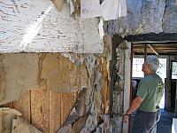 Leo admires the decore in one of the abandoned buildings