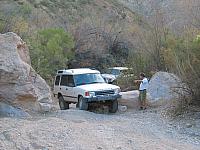 Mike helps Corey past a rock.